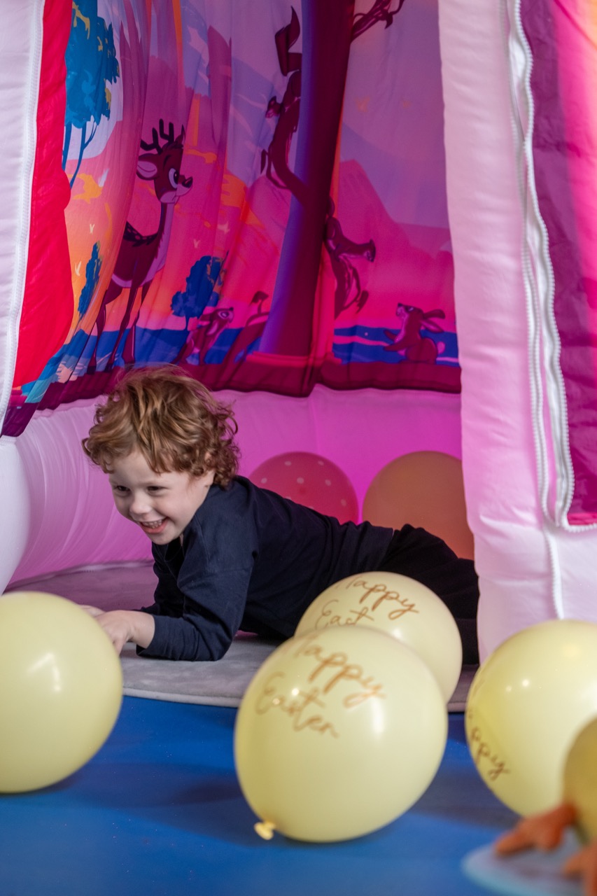 Children interacting with colorful sensory wall panels at The Angel Centre Sensory Gym