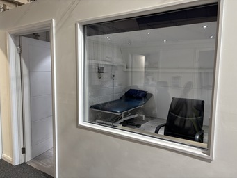 Wheelchair accessible clinic room entrance and viewing window at The Angel Centre