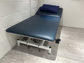 Healthcare examination table in The Angel Centre clinic room