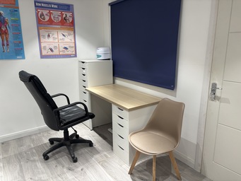 Healthcare consultation desk and seating in The Angel Centre clinic room